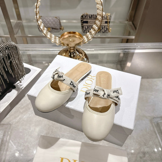 CD 26 Bow Flat Mules Embroidered Sheepskin